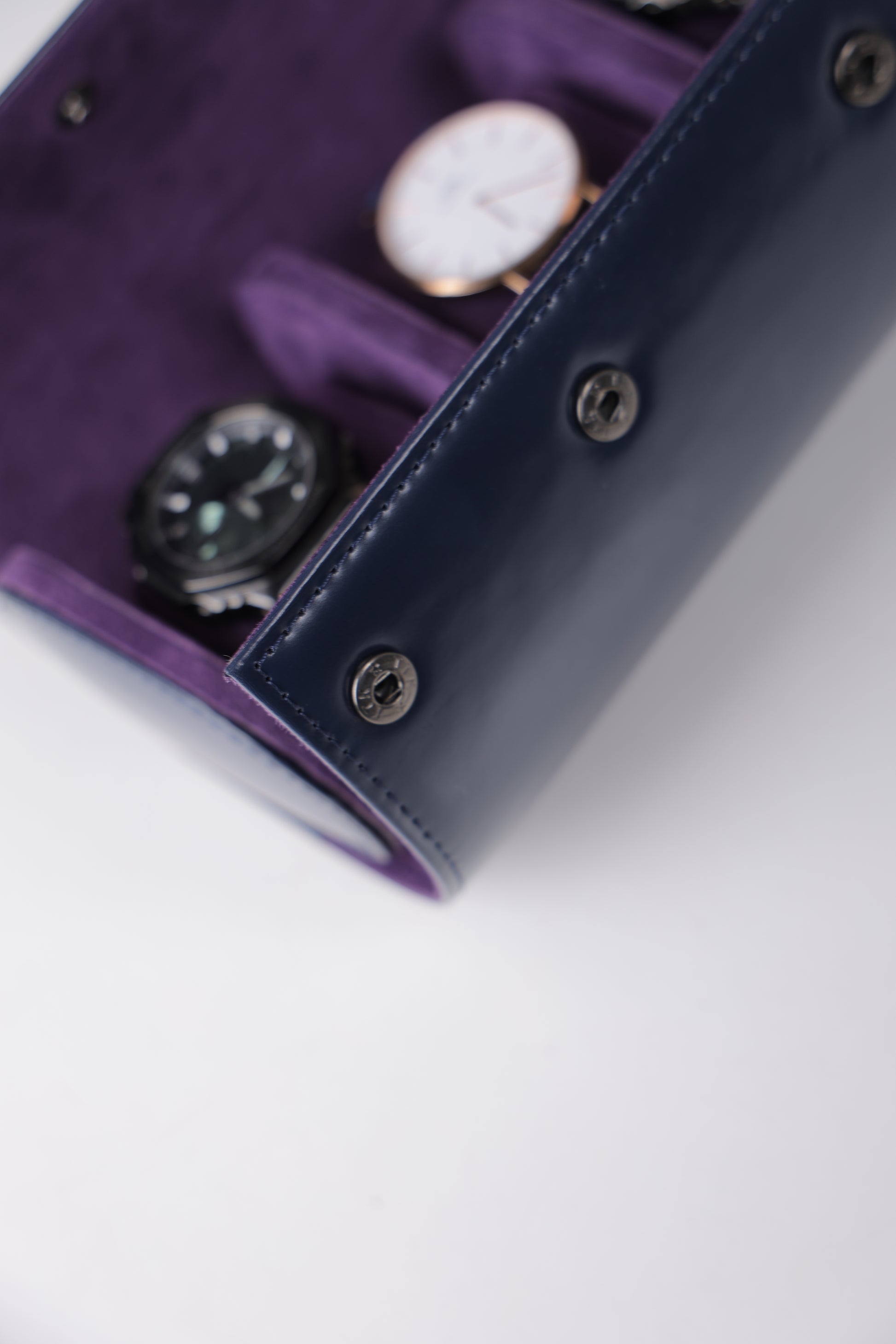 NAVY PATENT EXTERIOR AND PURPLE INTERIOR WATCH ROLL- 3 SLOT