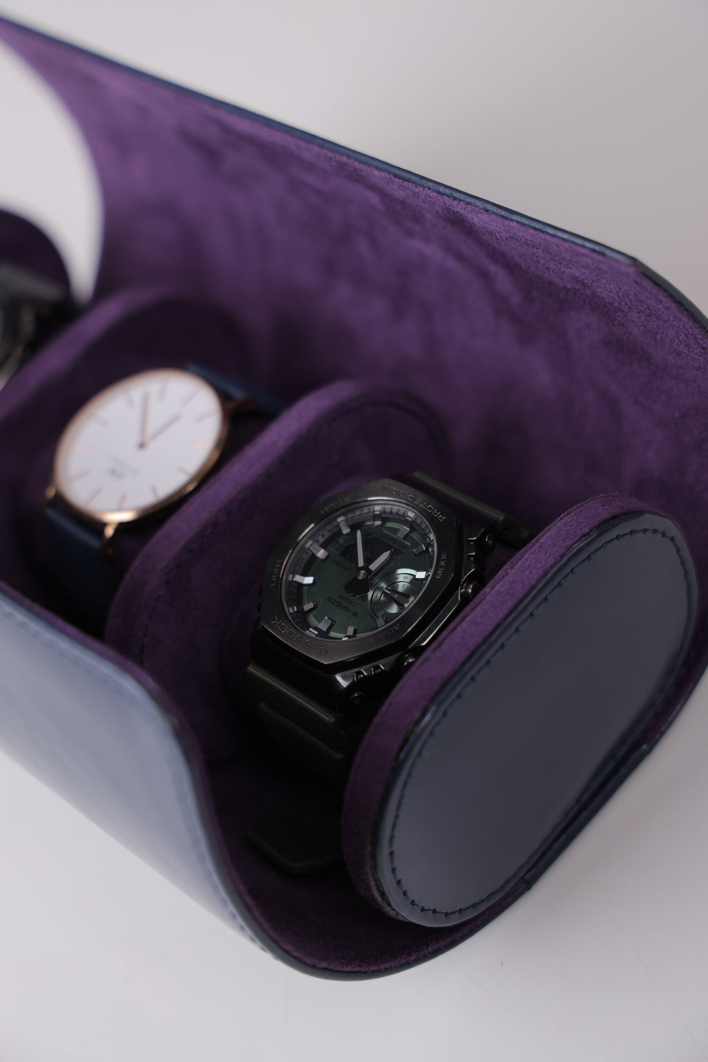 NAVY PATENT EXTERIOR AND PURPLE INTERIOR WATCH ROLL- 3 SLOT