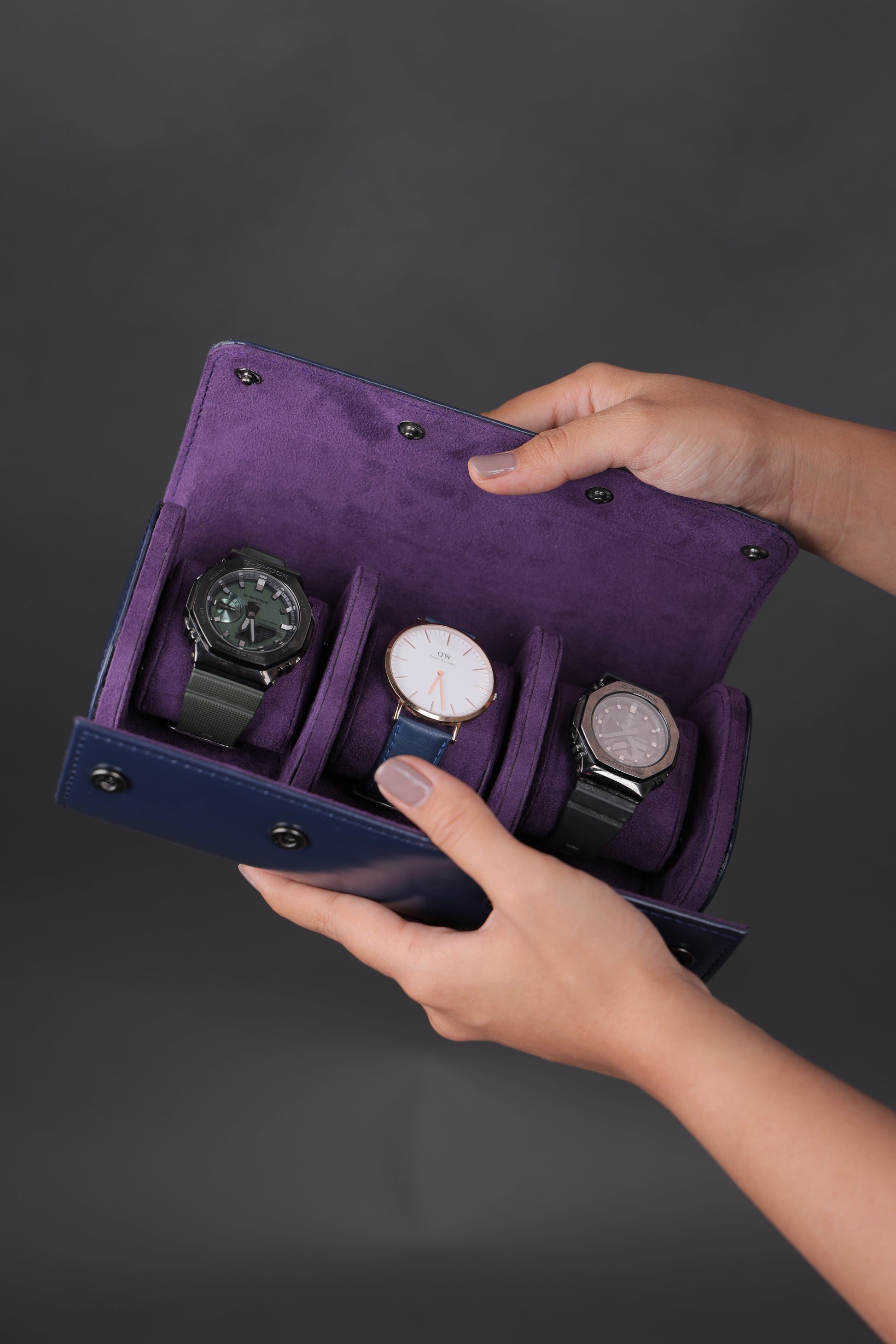 NAVY PATENT EXTERIOR AND PURPLE INTERIOR WATCH ROLL- 3 SLOT